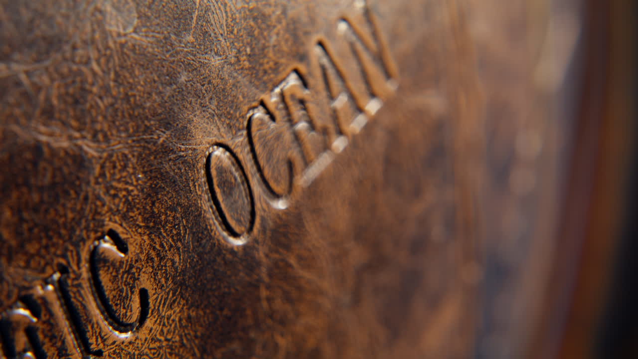 Closeup Pacific ocean engraved on retro globe surface. Vintage Earth model