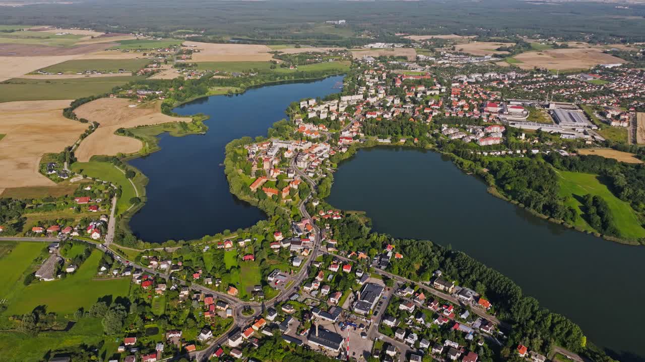 Vibrant aerial capture of Sztum town surrounded by lakes and lush summer fields