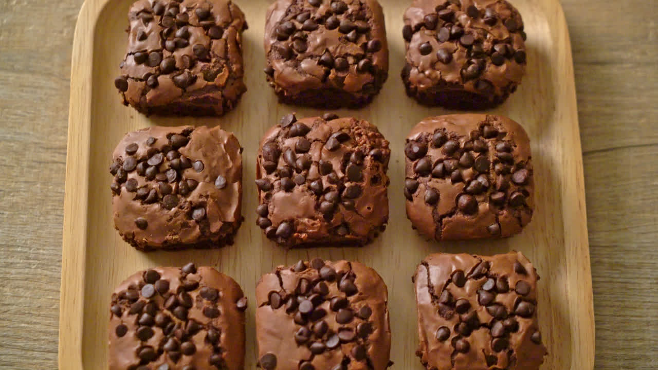 dark chocolate brownies with chocolate chips on top