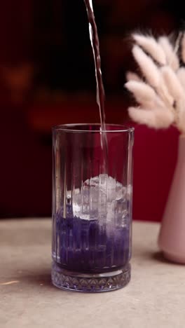 purple cocktail with ice