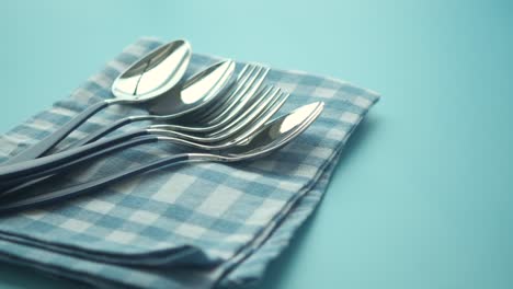 cutlery on a blue napkin