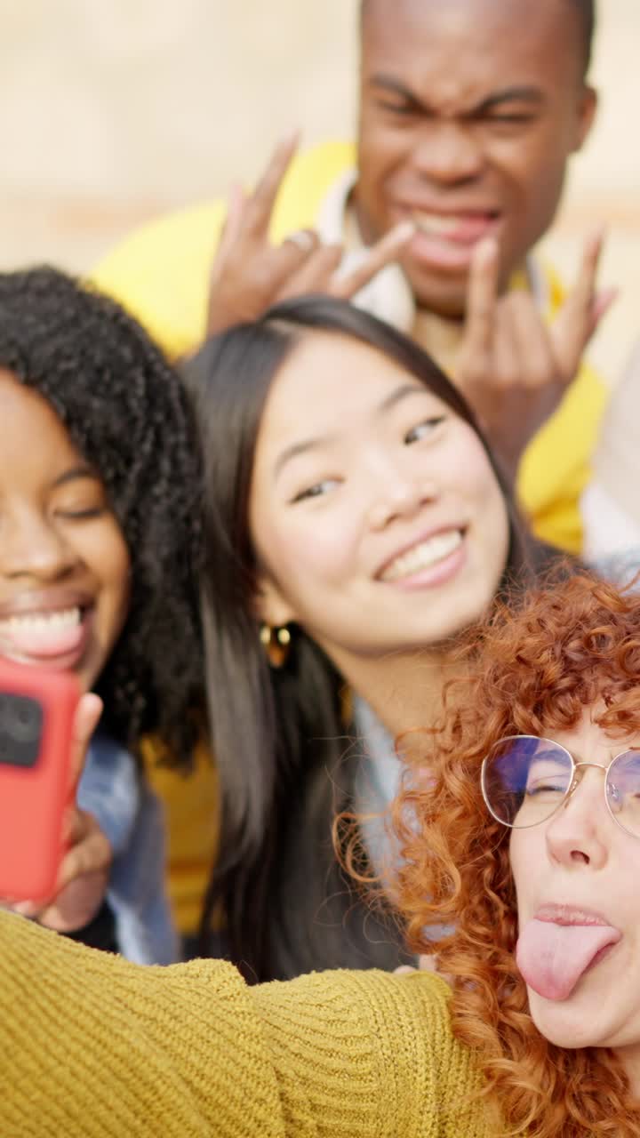Diverse friends taking a selfie and smiling in the city
