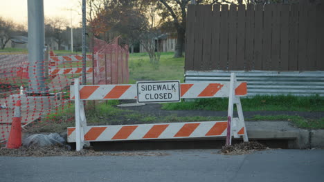 sidewalk closed sign during road construction