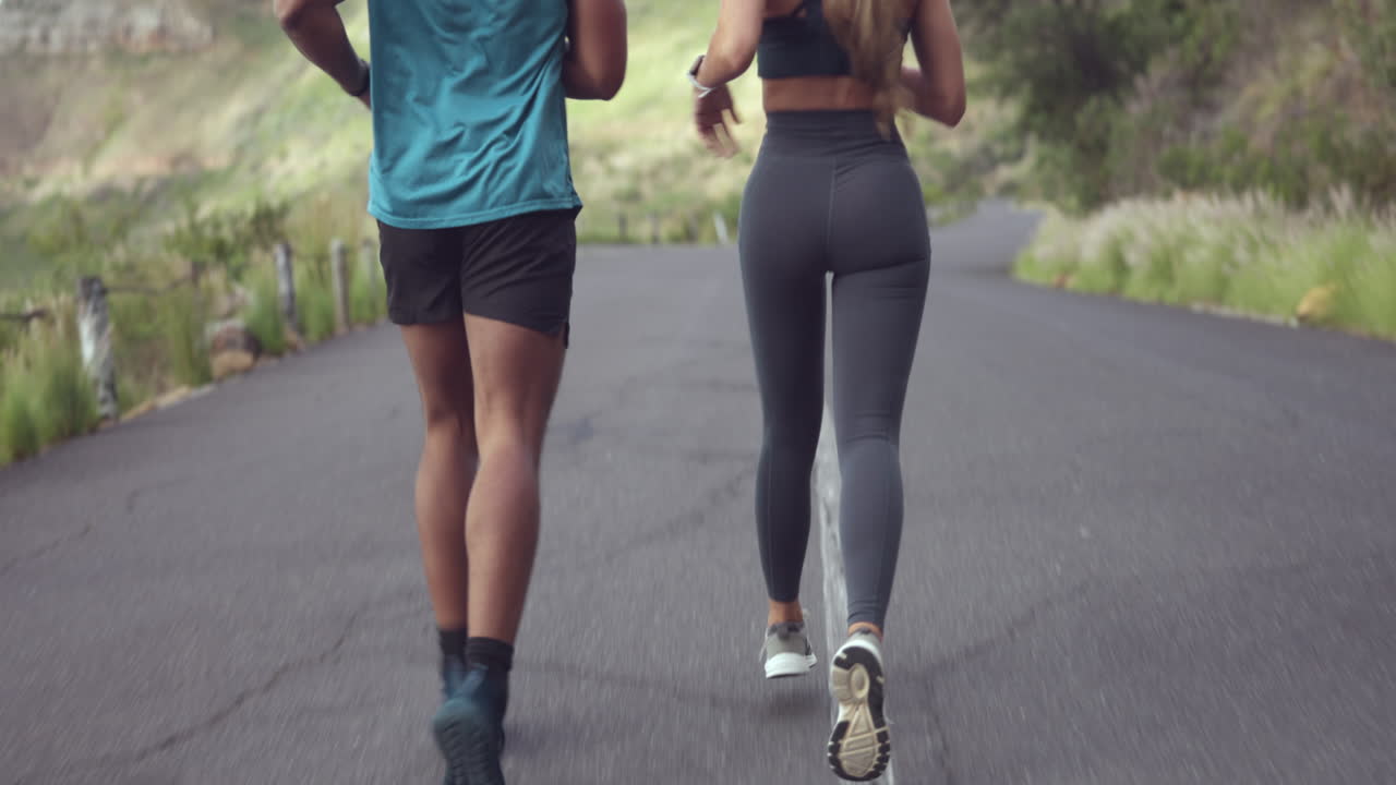 Fitness, running and couple of friends on road
