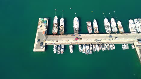 blanes multiple aerial views of blanes harbor and marina, showcasing boats, piers, and the cityscape
