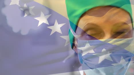 animation of bosnia and herzegovina flag over caucasian female surgeon in surgical mask at hospital