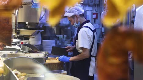 chef skillfully prepares roast duck in kitchen