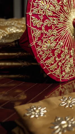 thai red umbrella with gold embroidery and fabric