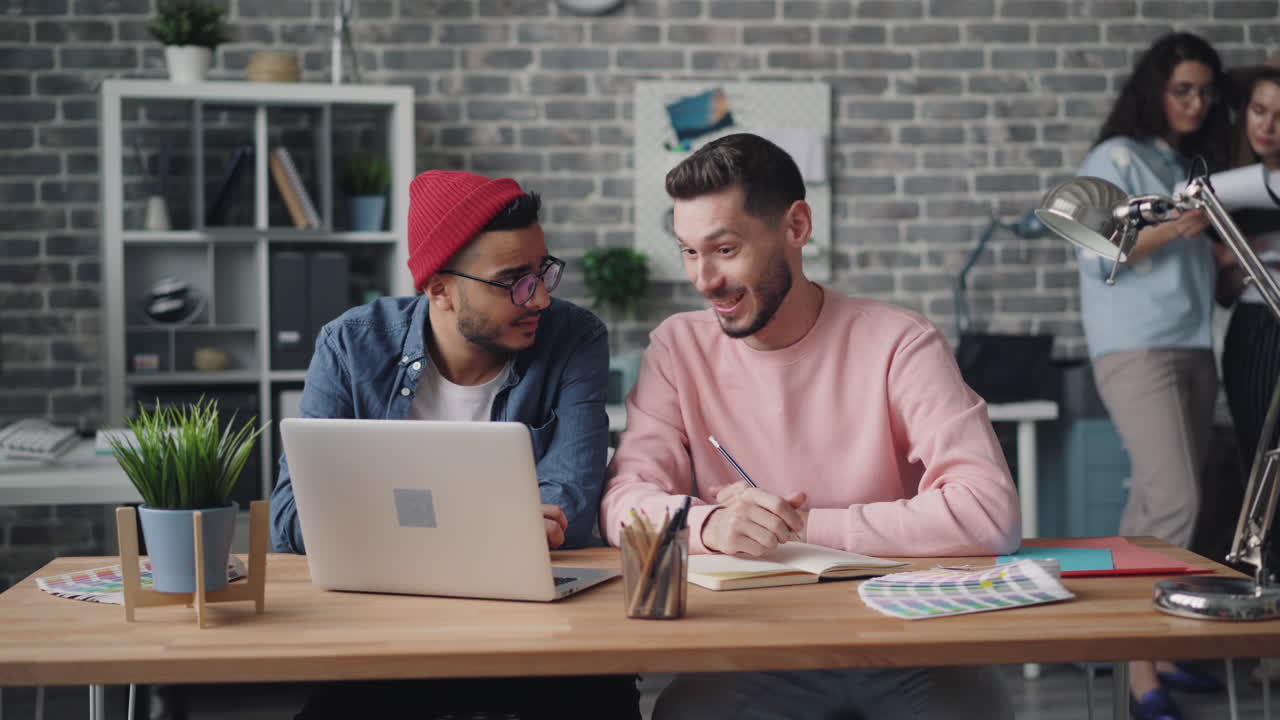 Two Men Discussing Design Ideas in a Modern Office