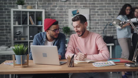 two men discussing design ideas in a modern office