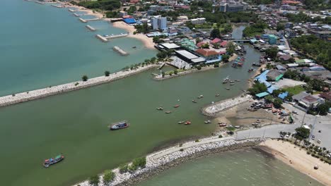 aerial view of a coastal town with fishing boats