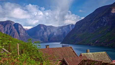 A-cruise-ship-sails-out-of-a-beautiful-wide-fjord-in-Norway