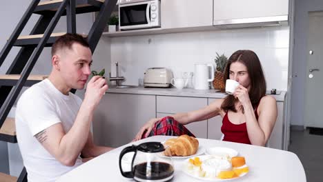 couple enjoying breakfast in the kitchen