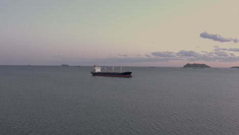 general cargo ship at the anchorage in the evening, far east, russia