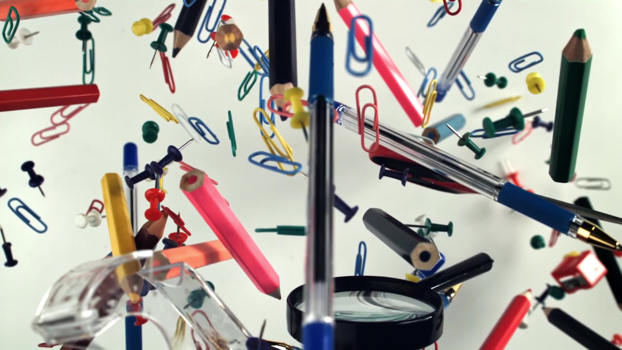 Colorful Office and School Supplies Floating on White Background