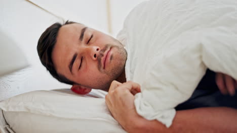 phone, alarm and a man in bed to wake up