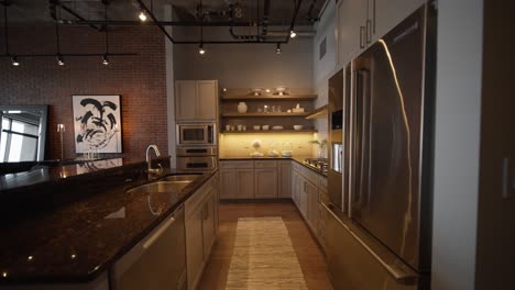 wide-push-in-of-a-modern-kitchen-with-grey-finishes