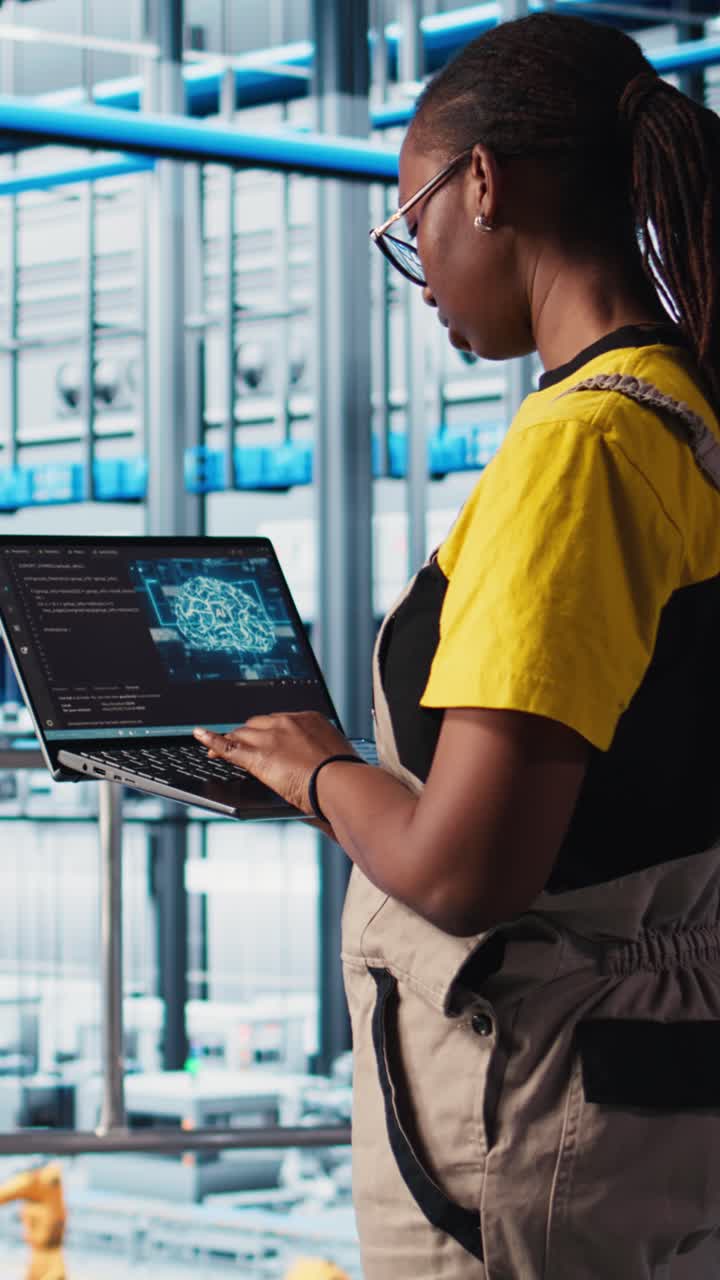 Vertical video Industry 4.0 industrial plant engineer controlling automated machinery using AI