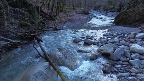 drone shot of river landscape in the shadow