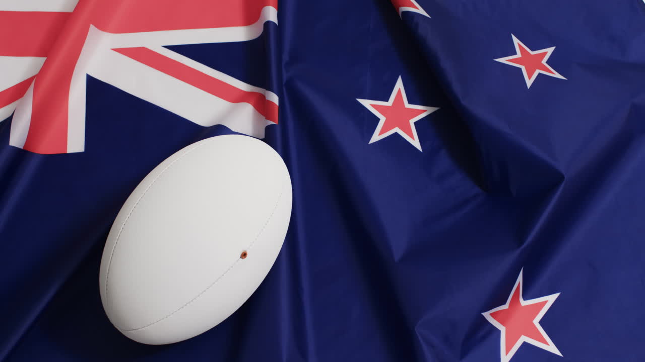 animación de una pelota blanca de rugby sobre la bandera de australia