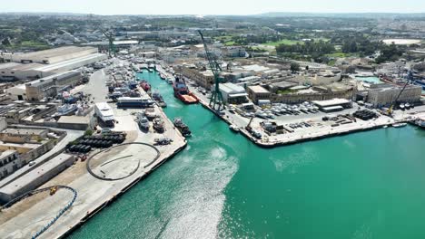 aerial drone shot revealing a boat yard from far away