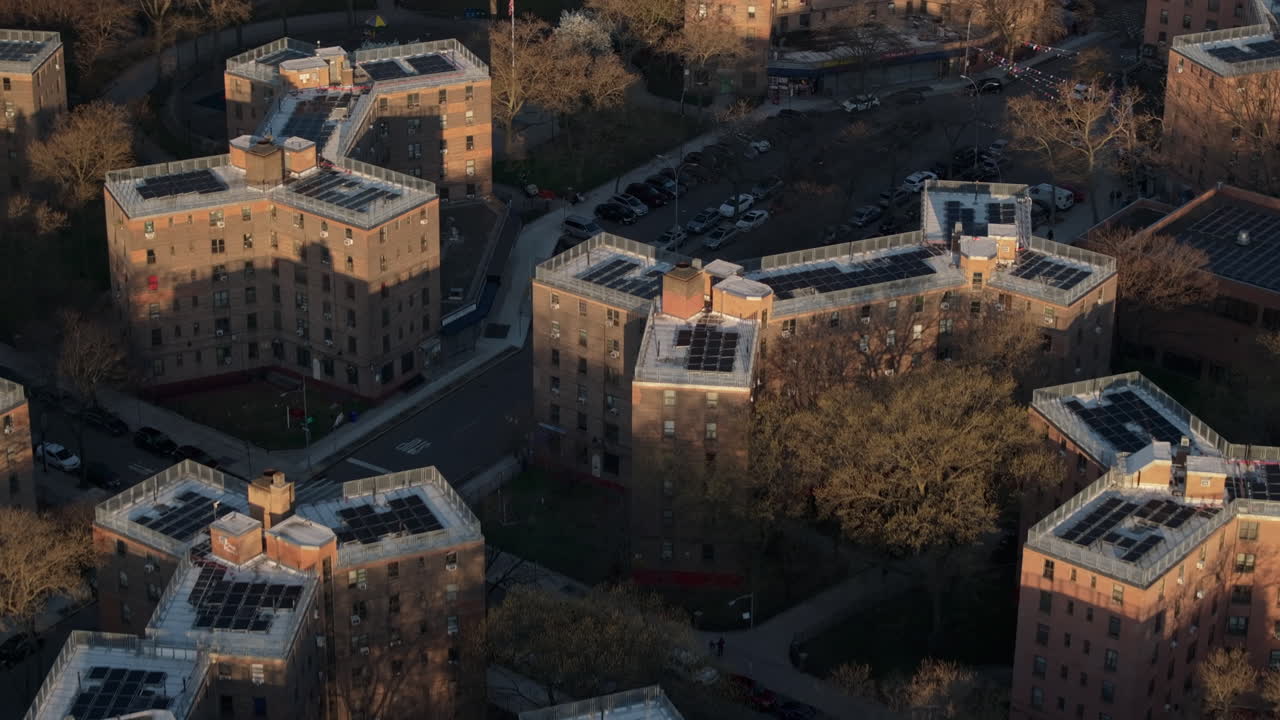 Aerial view of solar panels on public housing project buildings. Shot at sunrise in Queensbridge, Queens, New York City.