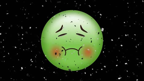 animación digital de confeti cayendo sobre un emoji de cara enferma verde sobre un fondo negro