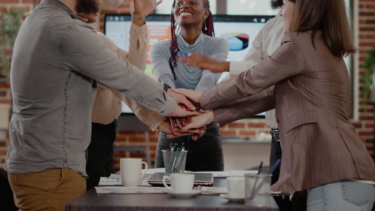 Cheerful group of workmates celebrating business success