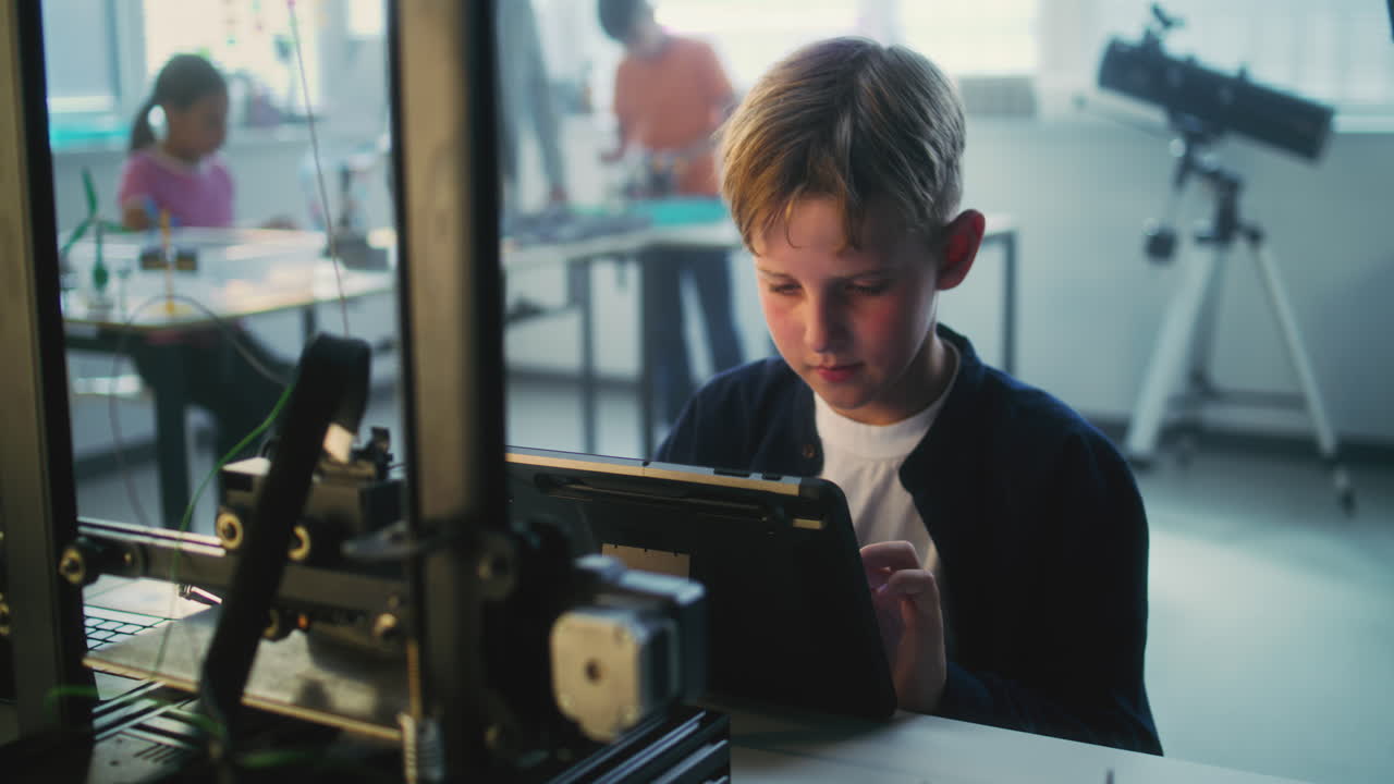 Boy using tablet in a science classroom