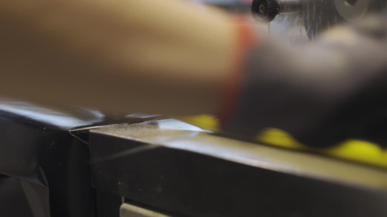 hand chopping caramel candy strips
