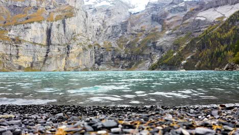 turquoise lake oeschinensee in kandersteg, bern, in the alps of switzerland