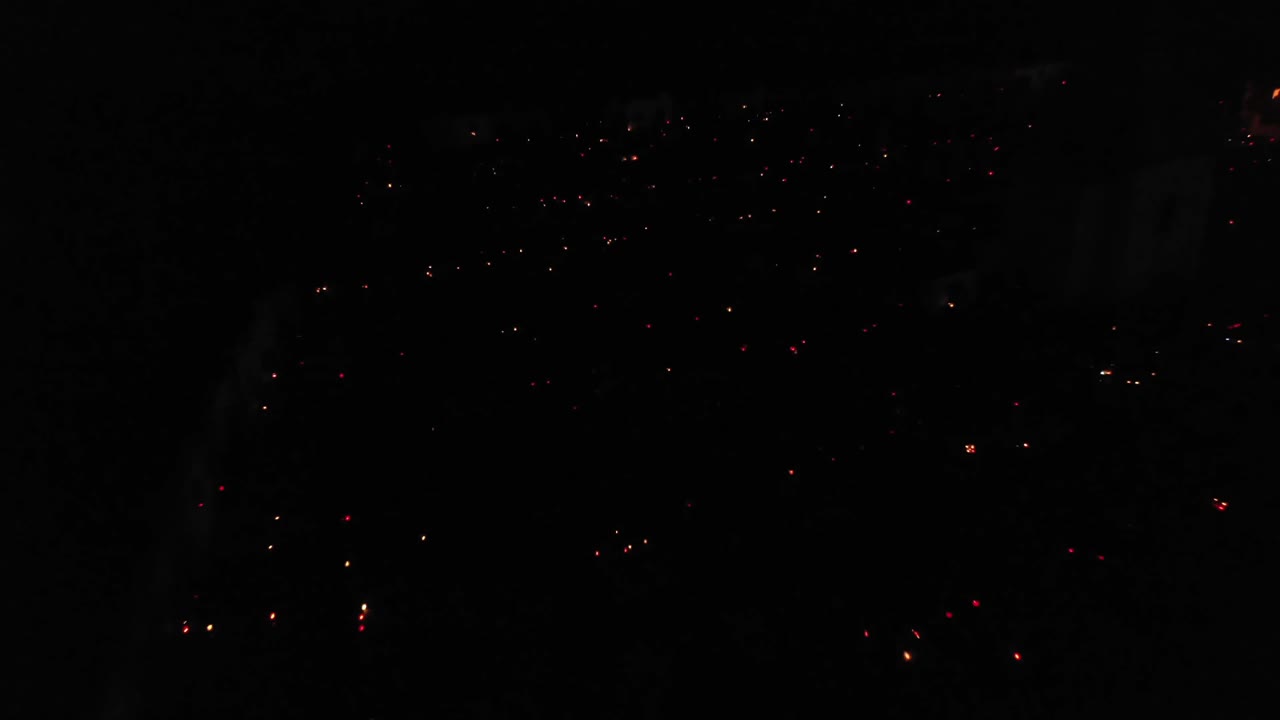 Tiny Lit Candles On The Graves At Cemetery During All Saints Day