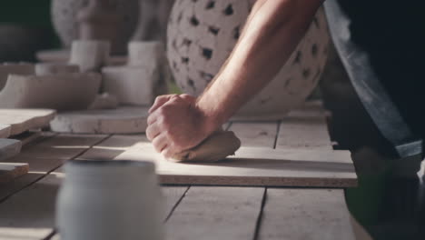 artisan sculpting clay