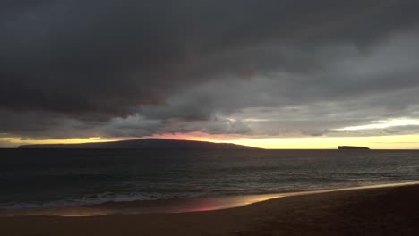 Cinematic-scenic-sunset-view-of-Molokini-Crater-and-the-sacred-Hawaiian-island-of-Kaho’olawe-from-the-southern-coast-of-Maui-in-Hawai'i