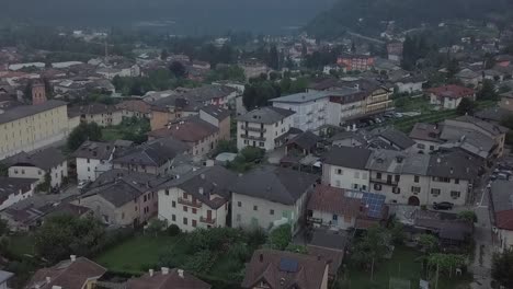 Aerial-reveal-type-clip-of-Levico-Terme,-Italy,-during-sunrise