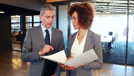 business team standing together discussing work