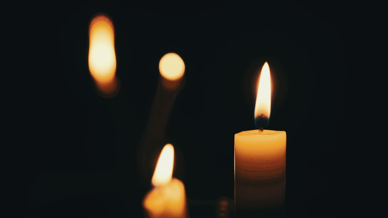 Candles Flame on Black Background