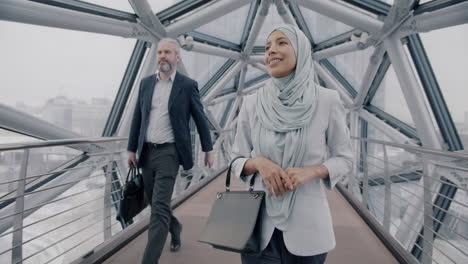 business professionals on a modern city bridge