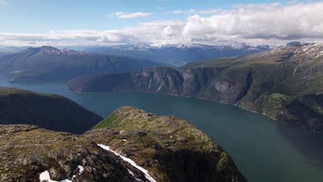 large calm lake between the fjords of hardangervidda