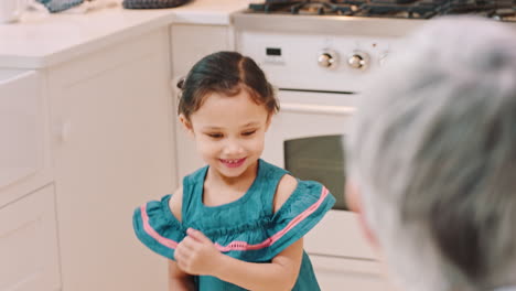 Grandmother,-girl-and-hug-with-love-in-home