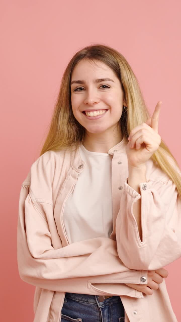Young woman showing different facial expressions on pink background