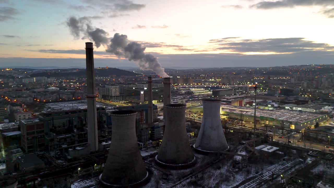 Smoke rising from industrial plant at sunset in Iasi Romania