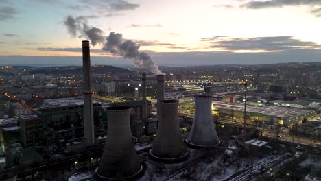 smoke rising from industrial plant at sunset in iasi romania