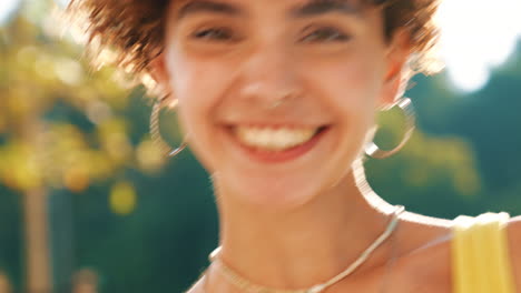 young woman smiling outdoors