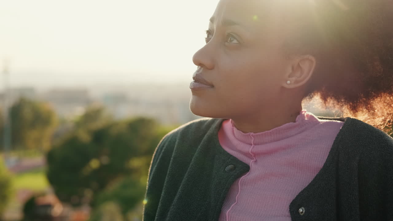 Young Woman Contemplating at Sunset