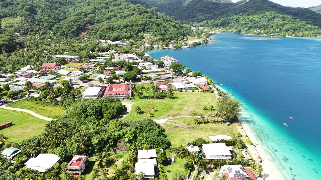 Aerial View of Huahine Island, French Polynesia. Fare Village Buildings, Turquoise Lagoon and Scenic Landscape