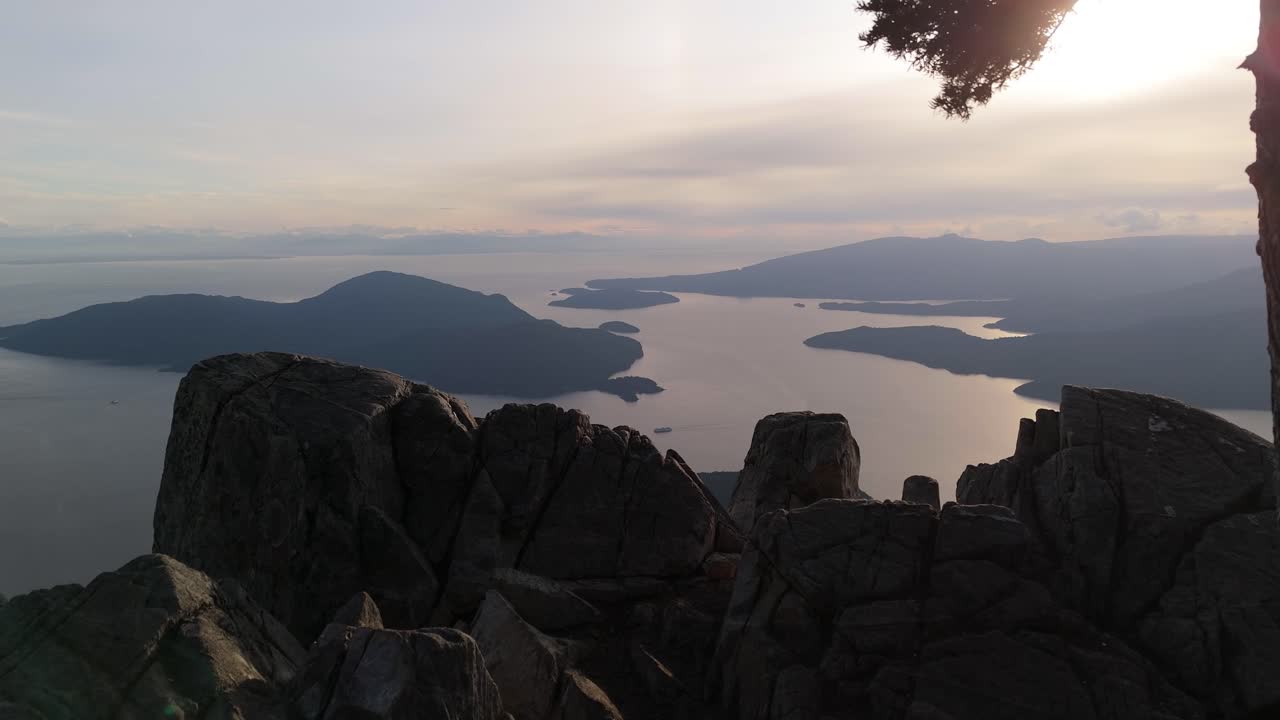Scenic View of Coastal Islands at Sunset from a Rocky Mountain Peak in BC