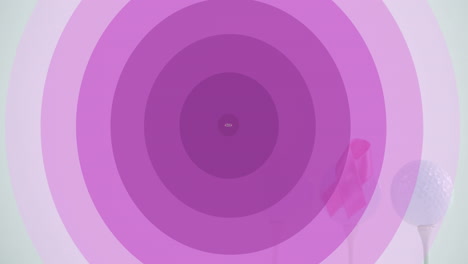 animación de círculos púrpuras y concienciación sobre el cáncer de mama sobre las pelotas de golf