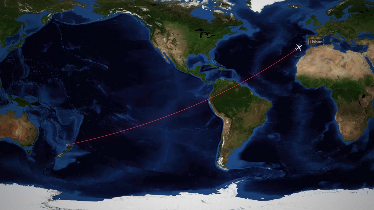A red line tracks an airplane flying across a world map from Auckland to Lisbon