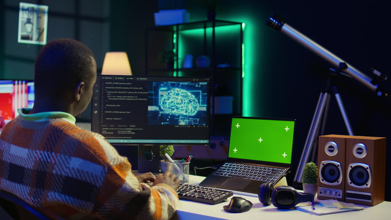 Coding on multiple monitors with green screen laptop